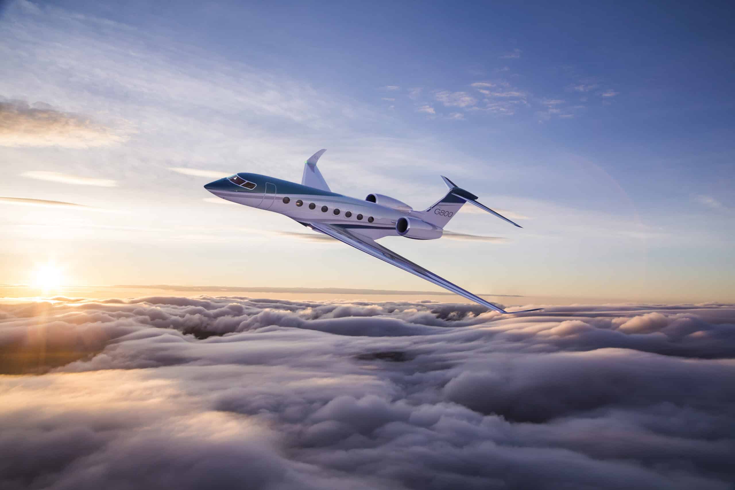 Private jet flying above clouds at golden hour
